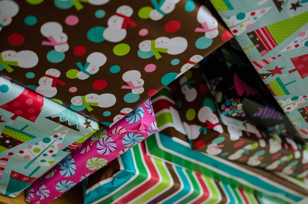 A pile of presents wrapped in many different wrapping papers